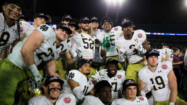 Notre Dame celebrates its win against South Carolina at TIAA Jacksonville Stadium during the Taxslayer Gator Bowl.